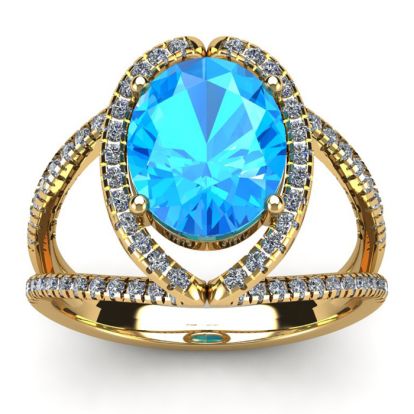 3 3/4 Carat Oval Shape Blue Topaz and Halo Diamond Ring In 14 Karat Yellow Gold