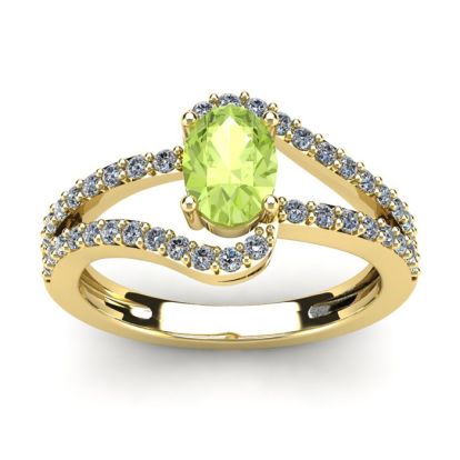 1 1/3 Carat Oval Shape Peridot and Fancy Diamond Ring In 14 Karat Yellow Gold