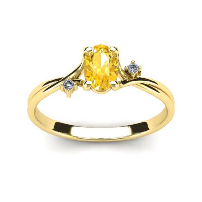 1/2 Carat Oval Shape Citrine and Two Diamond Accent Ring In 14 Karat Yellow Gold