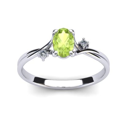 1/2 Carat Oval Shape Peridot and Two Diamond Accent Ring In 14 Karat White Gold