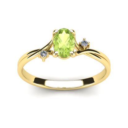 1/2 Carat Oval Shape Peridot and Two Diamond Accent Ring In 14 Karat Yellow Gold