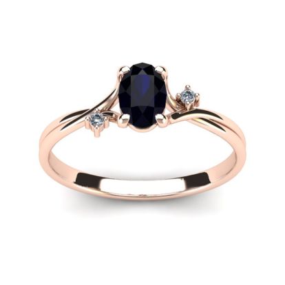 1/2 Carat Oval Shape Sapphire and Two Diamond Accent Ring In 14 Karat Rose Gold