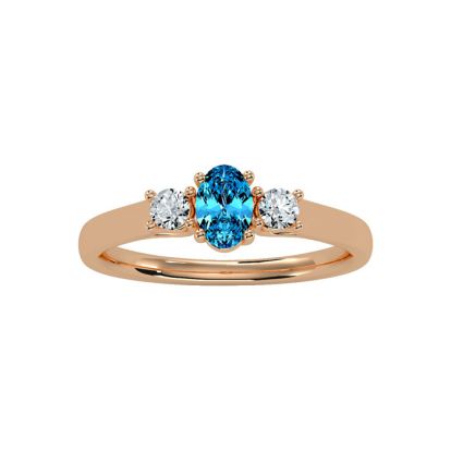 3/4 Carat Oval Shape Blue Topaz and Two Diamond Ring In 14 Karat Rose Gold