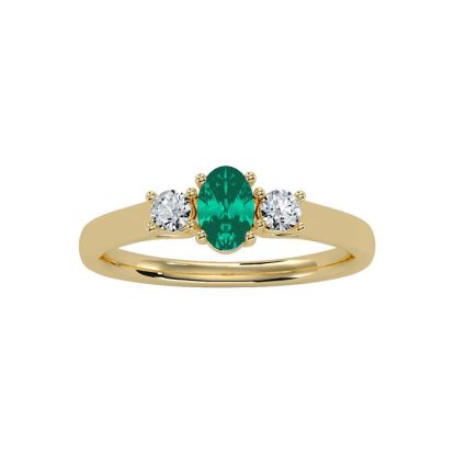 1/2 Carat Oval Shape Emerald and Two Diamond Ring In 14 Karat Yellow Gold