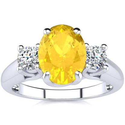 1 1/4 Carat Oval Shape Citrine and Two Diamond Ring In 14 Karat White Gold