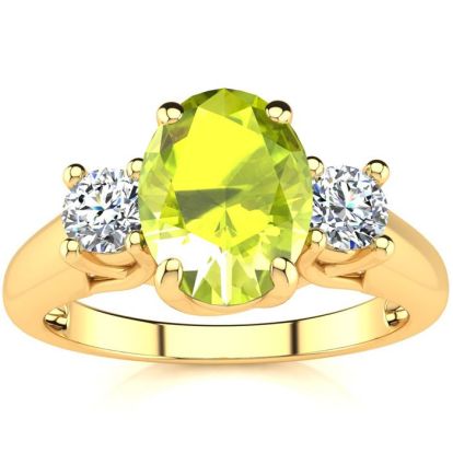 1 1/2 Carat Oval Shape Peridot and Two Diamond Ring In 14 Karat Yellow Gold