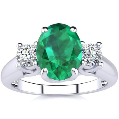 1 1/3 Carat Oval Shape Emerald and Two Diamond Ring In 14 Karat White Gold