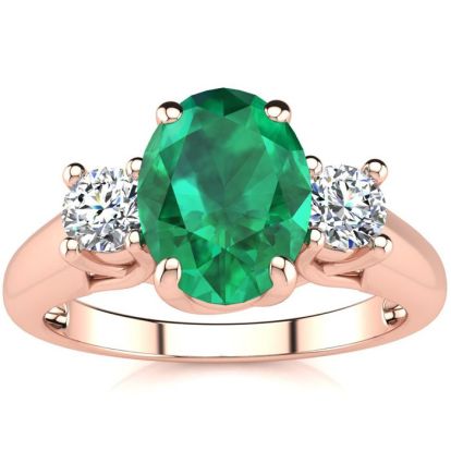 1 1/3 Carat Oval Shape Emerald and Two Diamond Ring In 14 Karat Rose Gold