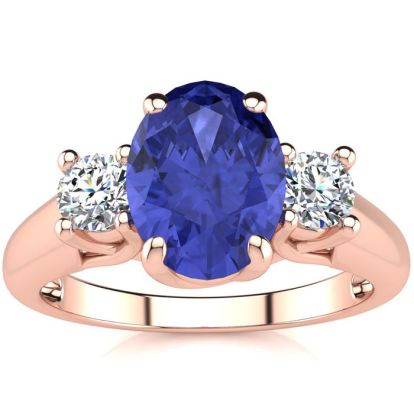1 1/2 Carat Oval Shape Tanzanite and Two Diamond Ring In 14 Karat Rose Gold