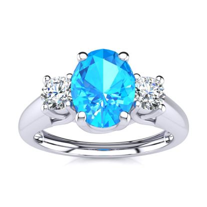 1 1/5 Carat Oval Shape Blue Topaz and Two Diamond Ring In 14 Karat White Gold
