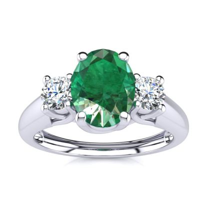 1 Carat Oval Shape Emerald and Two Diamond Ring In 14 Karat White Gold