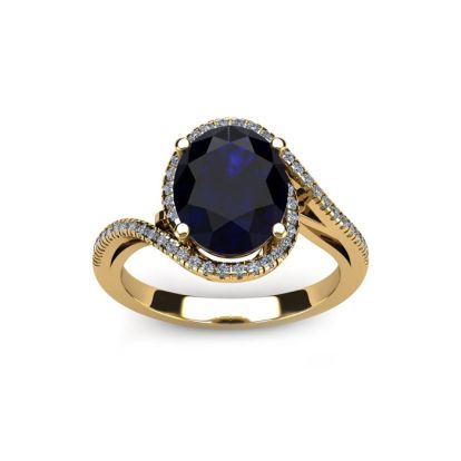 1 1/4 Carat Oval Shape Sapphire and Halo Diamond Ring In 14 Karat Yellow Gold