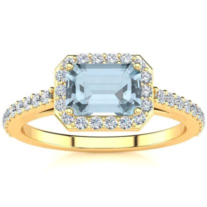 Aquamarine Ring: Aquamarine Jewelry: 1 1/4 Carat Aquamarine and Halo Diamond Ring In 14 Karat Yellow Gold