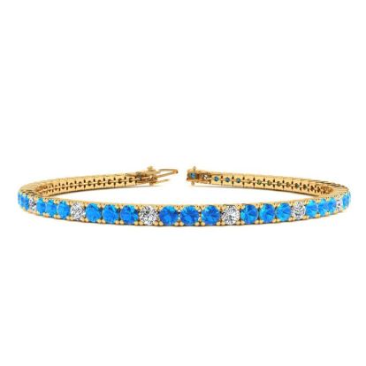 3 Carat Blue Topaz And Diamond Alternating Tennis Bracelet In 14 Karat Yellow Gold, 6 Inches