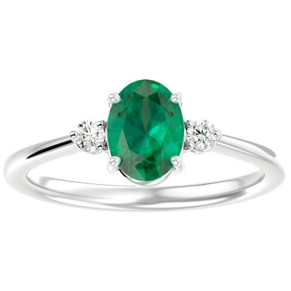 1 1/4 Carat Oval Shape Emerald and Two Diamond Ring In 14 Karat White Gold