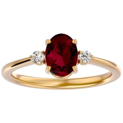 1.65 Carat Oval Shape Ruby and Two Diamond Ring In 14 Karat Yellow Gold