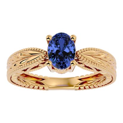 1 1/3 Carat Oval Shape Tanzanite Ring With Tapered Etched Band In 14 Karat Yellow Gold