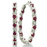 Hoop earrings will always be in style!  Be sure to grab these fabulous ruby and diamond hoop earrings.  Each earring has 12 ruby stones and are set in sterling silver.  Dangling at about 1 inches down, they are perfect for everyone.  Total gem weight is 1.5 carats.  Diamond content is .01 carats, diamond color is J-K and diamond clarity is I2-I3. Image-1