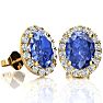 2.90 Carat Oval Shape Tanzanite and Halo Diamond Stud Earrings In 14 Karat Yellow Gold Image-1