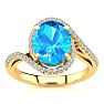 3 1/2 Carat Oval Shape Blue Topaz and Halo Diamond Ring In 14 Karat Yellow Gold Image-1