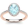 Aquamarine Ring: Aquamarine Jewelry: 1 1/3 Carat Oval Shape Aquamarine and Halo Diamond Ring In 14 Karat Rose Gold Image-1
