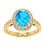 1 3/4 Carat Oval Shape Blue Topaz and Halo Diamond Ring In 14 Karat Yellow Gold Image-1