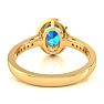 1 3/4 Carat Oval Shape Blue Topaz and Halo Diamond Ring In 14 Karat Yellow Gold Image-5