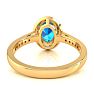 1 3/4 Carat Oval Shape Blue Topaz and Halo Diamond Ring In 14 Karat Yellow Gold Image-5
