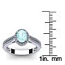 Aquamarine Ring: Aquamarine Jewelry: 1 1/4 Carat Oval Shape Aquamarine and Halo Diamond Ring In 14 Karat White Gold Image-5