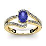 1 1/3 Carat Oval Shape Tanzanite and Fancy Diamond Ring In 14 Karat Yellow Gold Image-1