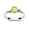 1/2 Carat Oval Shape Peridot and Two Diamond Accent Ring In 14 Karat Rose Gold Image-1