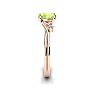 1/2 Carat Oval Shape Peridot and Two Diamond Accent Ring In 14 Karat Rose Gold Image-3