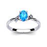 1/2 Carat Oval Shape Blue Topaz and Two Diamond Accent Ring In 14 Karat White Gold Image-1