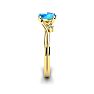 1/2 Carat Oval Shape Blue Topaz and Two Diamond Accent Ring In 14 Karat Yellow Gold Image-3