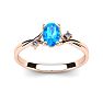 1/2 Carat Oval Shape Blue Topaz and Two Diamond Accent Ring In 14 Karat Rose Gold Image-1