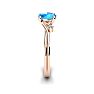 1/2 Carat Oval Shape Blue Topaz and Two Diamond Accent Ring In 14 Karat Rose Gold Image-3