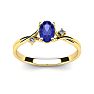 1/2 Carat Oval Shape Tanzanite and Two Diamond Accent Ring In 14 Karat Yellow Gold Image-1