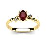 Garnet Ring: Garnet Jewelry: 1/2 Carat Oval Shape Garnet and Two Diamond Accent Ring In 14 Karat Yellow Gold Image-1