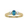 3/4 Carat Oval Shape Blue Topaz and Two Diamond Ring In 14 Karat Yellow Gold Image-1