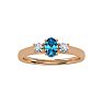 3/4 Carat Oval Shape Blue Topaz and Two Diamond Ring In 14 Karat Rose Gold Image-1