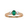 1/2 Carat Oval Shape Emerald and Two Diamond Ring In 14 Karat Rose Gold Image-1