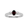 Garnet Ring: Garnet Jewelry: 3/4 Carat Oval Shape Garnet and Two Diamond Ring In 14 Karat White Gold Image-1