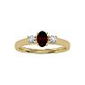 Garnet Ring: Garnet Jewelry: 3/4 Carat Oval Shape Garnet and Two Diamond Ring In 14 Karat Yellow Gold Image-1