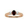 Garnet Ring: Garnet Jewelry: 3/4 Carat Oval Shape Garnet and Two Diamond Ring In 14 Karat Rose Gold Image-1