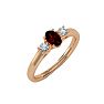 Garnet Ring: Garnet Jewelry: 3/4 Carat Oval Shape Garnet and Two Diamond Ring In 14 Karat Rose Gold Image-2