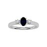 3/4 Carat Oval Shape Sapphire and Two Diamond Ring In 14 Karat White Gold Image-1