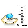 1 3/4 Carat Oval Shape Blue Topaz and Halo Diamond Ring In 14 Karat Yellow Gold Image-5