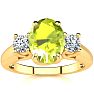 1 1/2 Carat Oval Shape Peridot and Two Diamond Ring In 14 Karat Yellow Gold Image-1