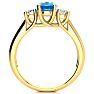 1 3/4 Carat Oval Shape Blue Topaz and Two Diamond Ring In 14 Karat Yellow Gold Image-3