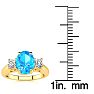 1 3/4 Carat Oval Shape Blue Topaz and Two Diamond Ring In 14 Karat Yellow Gold Image-5